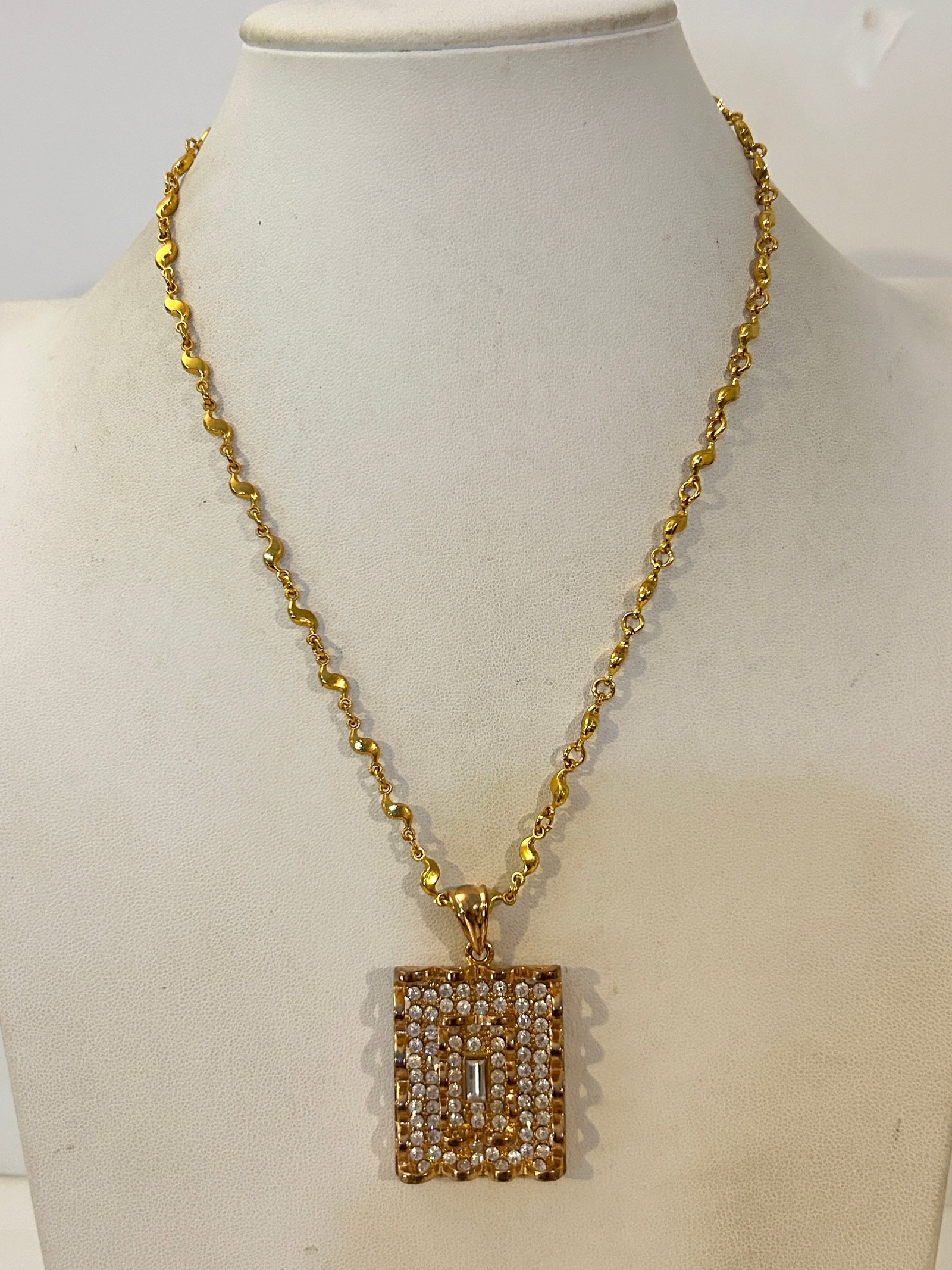 Vintage gold-tone pendant rhinestone-studded charm Necklace 18": Vintage gold-tone pendant rhinestone-studded charm Necklace 18" Please view all photos as they are part of the description and condition of this Item, Feel free to contact me with questions or picture