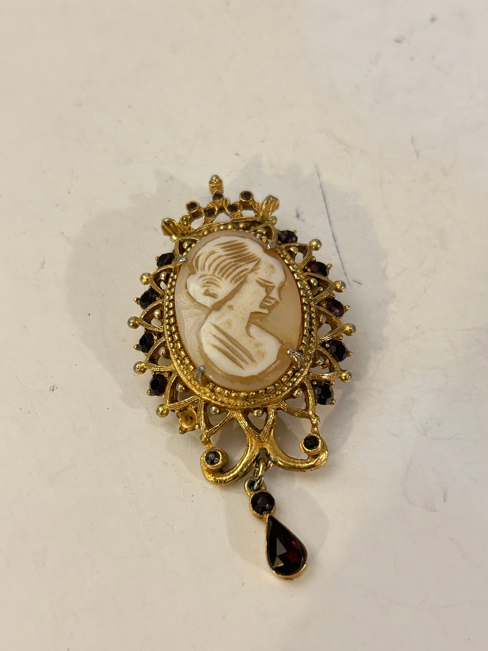 Vintage Florenza Cameo Brooch with Red Ruby Crystals, Dangle , Gold Tone: Vintage Florenza Cameo Brooch with Red Ruby Crystals, Dangle , Gold Tone Please view all photos as they are part of the description and condition of this Item, Feel free to contact me with questions o