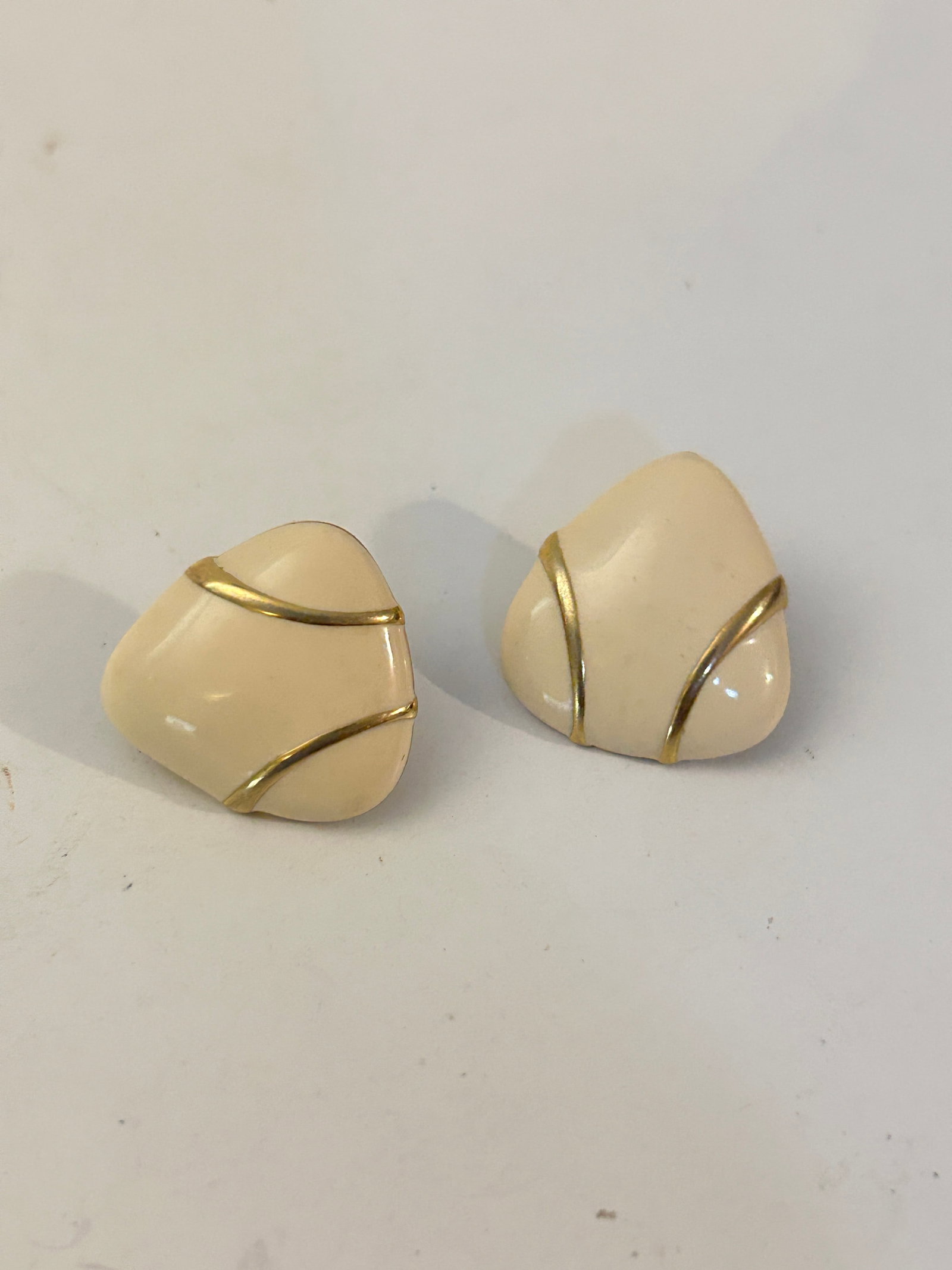 Vintage cream enamel and gold-tone clip-on Earrings: Vintage cream enamel and gold-tone clip-on Earrings Please view all photos as they are part of the description and condition of this Item, Feel free to contact me with questions or picture requests! U