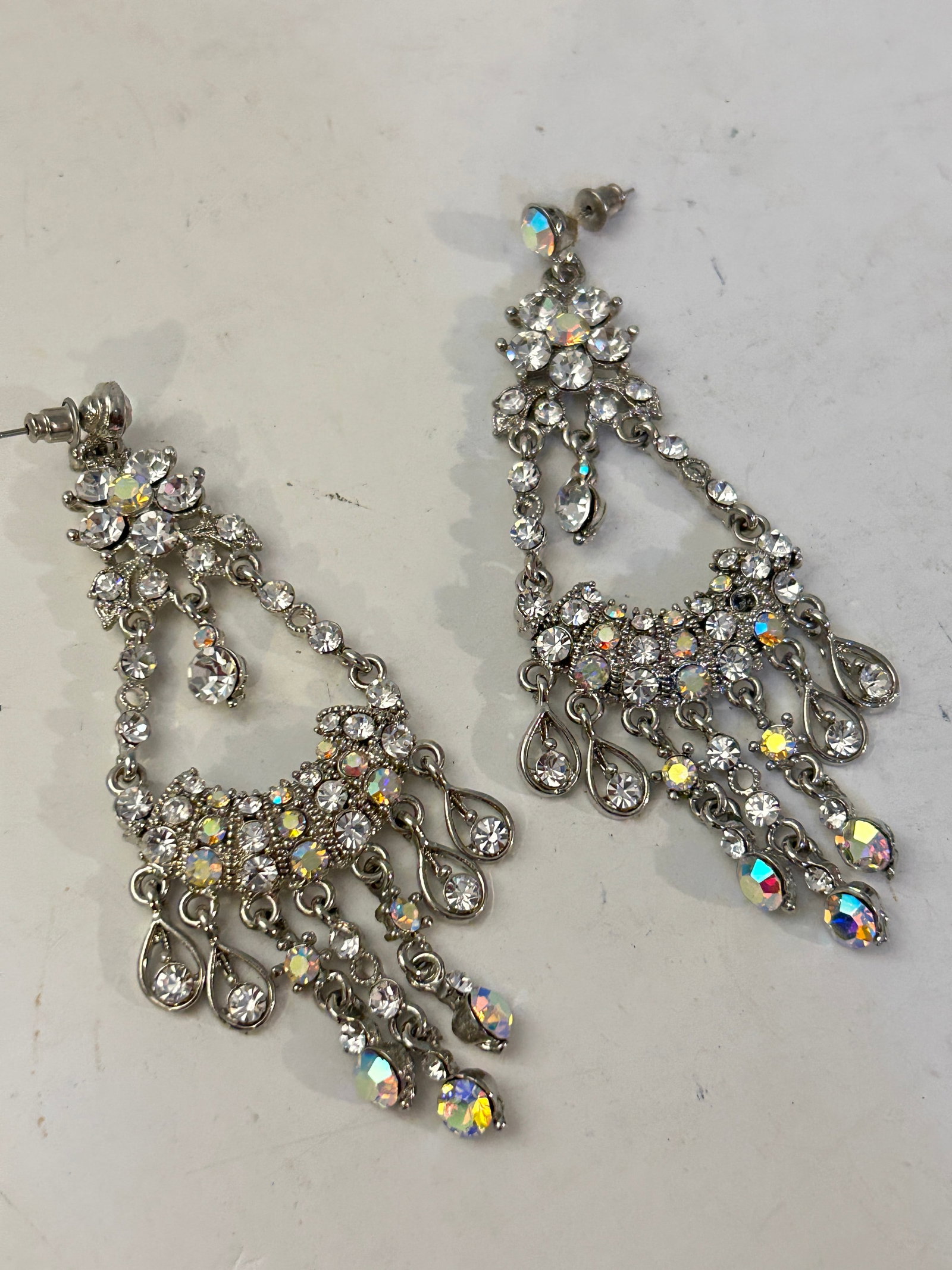 Vintage silver-tone chandelier earrings aurora borealis: Vintage silver-tone chandelier earrings aurora borealis Please view all photos as they are part of the description and condition of this Item, Feel free to contact me with questions or picture request