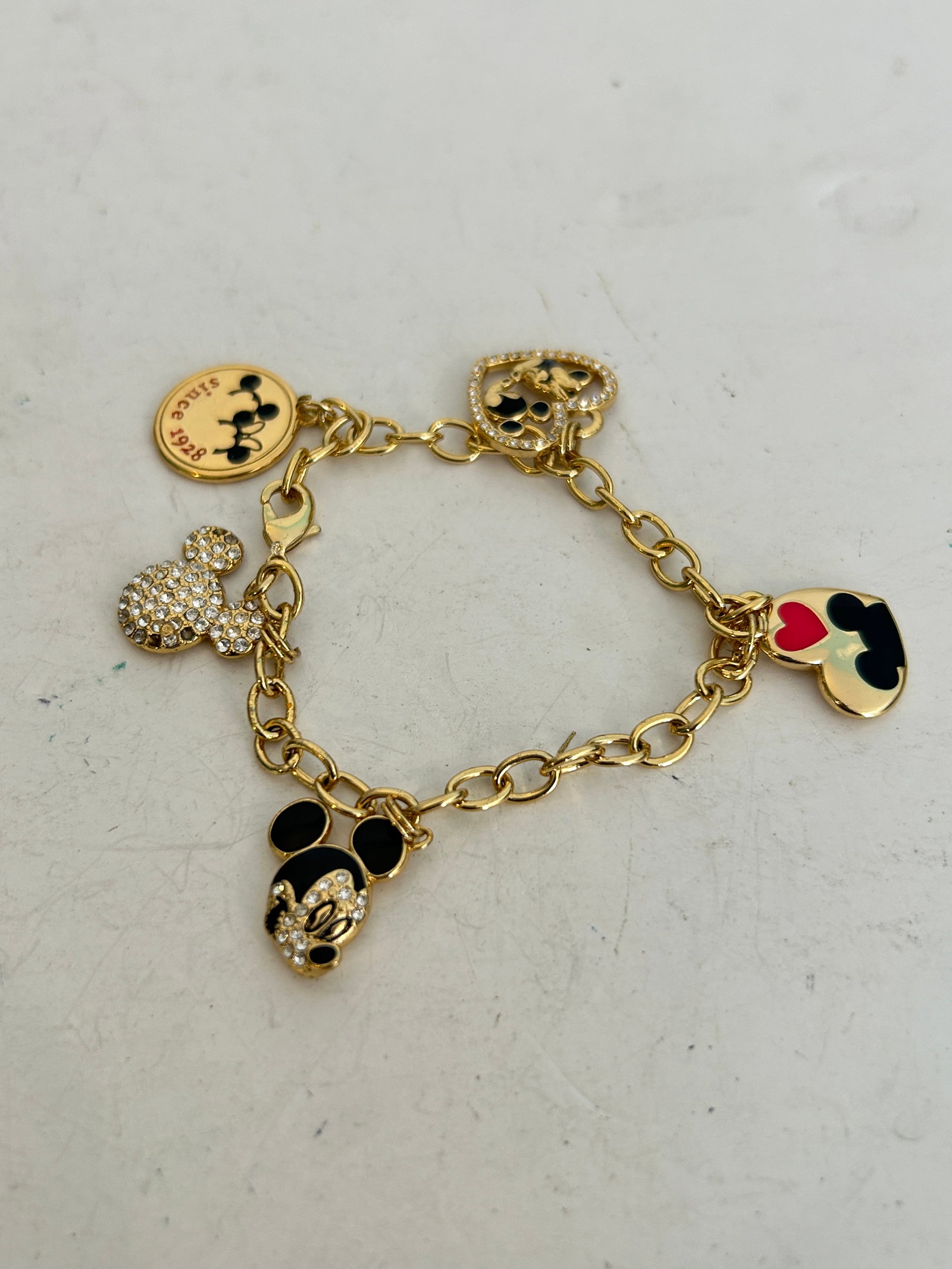 Vintage Mickey Mouse Charm Bracelet 7" missing 3 stones: Vintage Mickey Mouse Charm Bracelet 7" missing 3 stones Please view all photos as they are part of the description and condition of this Item, Feel free to contact me with questions or picture request