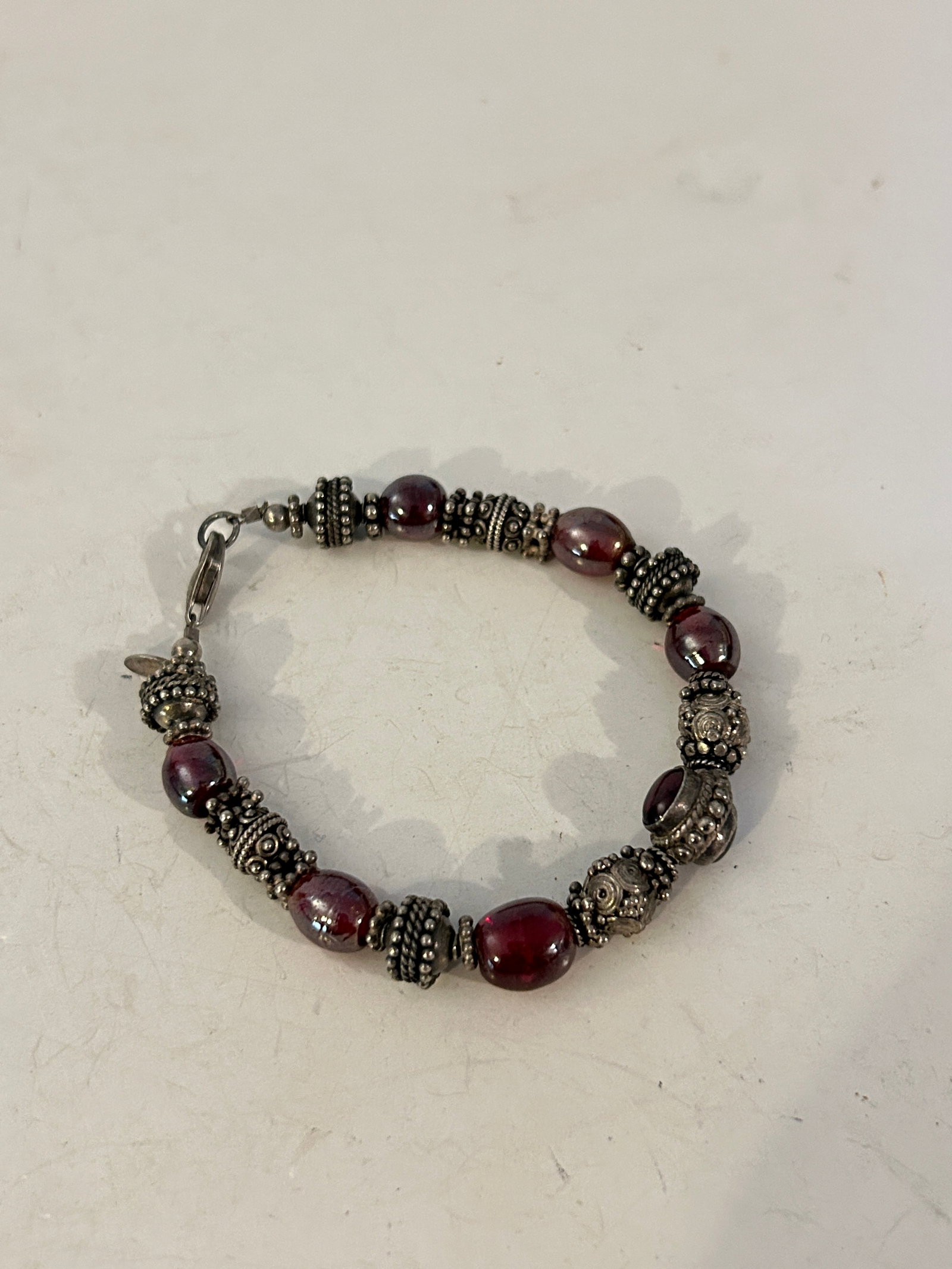 Vintage Garnet Bracelet: Sterling Silver Bali Beads: Vintage Garnet Bracelet: Sterling Silver Bali Beads Please view all photos as they are part of the description and condition of this Item, Feel free to contact me with questions or picture requests! U