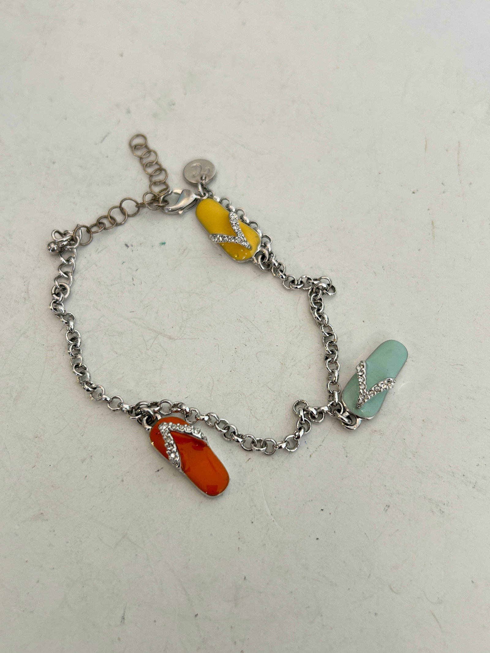 Vintage Liz Claiborne silver-tone charm flip-flop Bracelet 7": Vintage Liz Claiborne silver-tone charm flip-flop Bracelet 7" Please view all photos as they are part of the description and condition of this Item, Feel free to contact me with questions or picture r