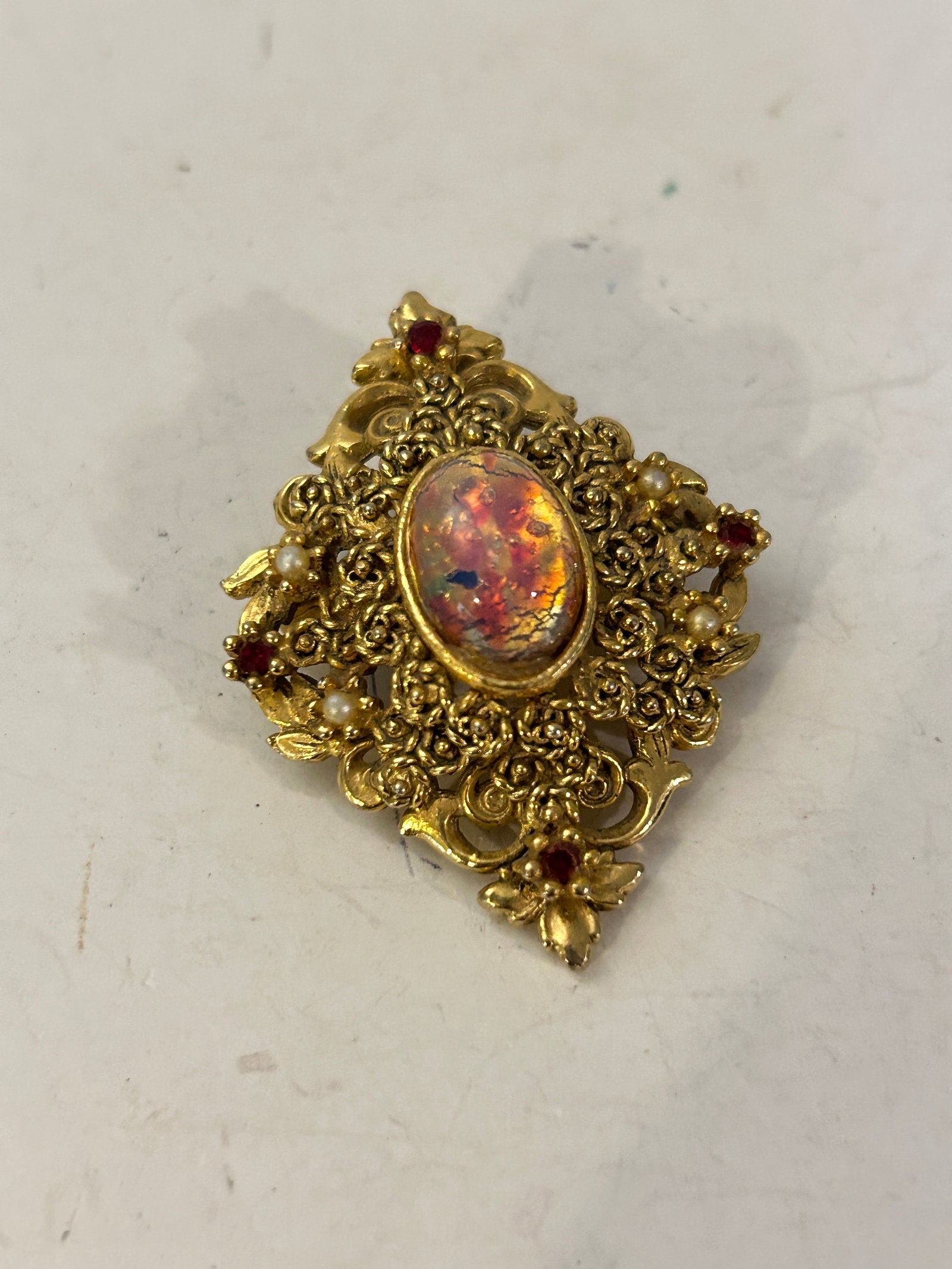 Vintage Pink Fire Opal Rhinestone Brooch: Vintage Pink Fire Opal Rhinestone Brooch Please view all photos as they are part of the description and condition of this Item, Feel free to contact me with questions or picture requests! Used Item AS