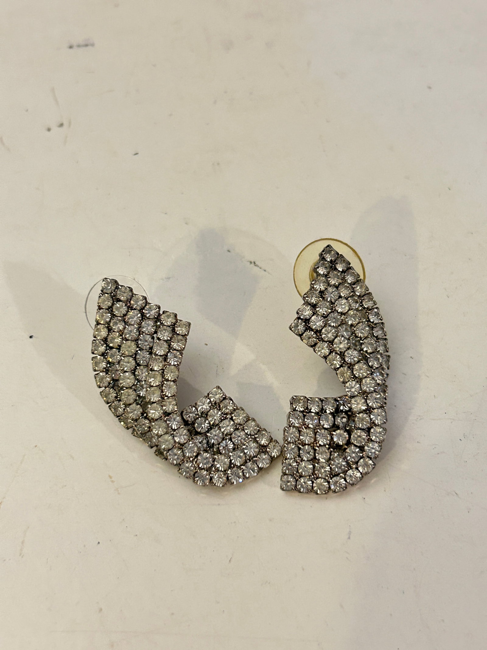 Vintage silver-tone rhinestone statement Earrings: Vintage silver-tone rhinestone statement Earrings Please view all photos as they are part of the description and condition of this Item, Feel free to contact me with questions or picture requests! Use