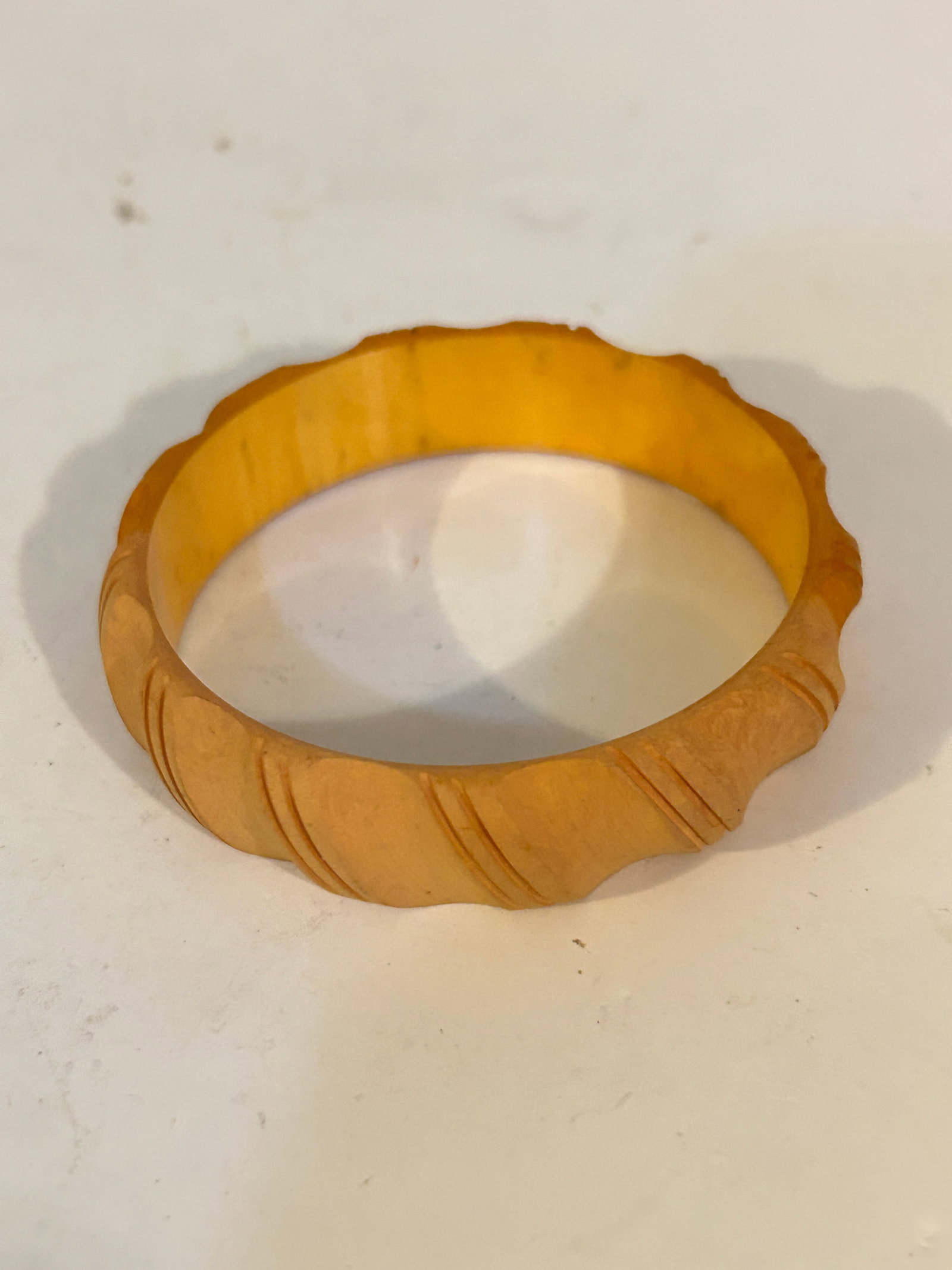 Vintage Butterscotch Bakelite Rope Carved Bangle Bracelet 7": Vintage Butterscotch Bakelite Rope Carved Bangle Bracelet 7" Please view all photos as they are part of the description and condition of this Item, Feel free to contact me with questions or picture re