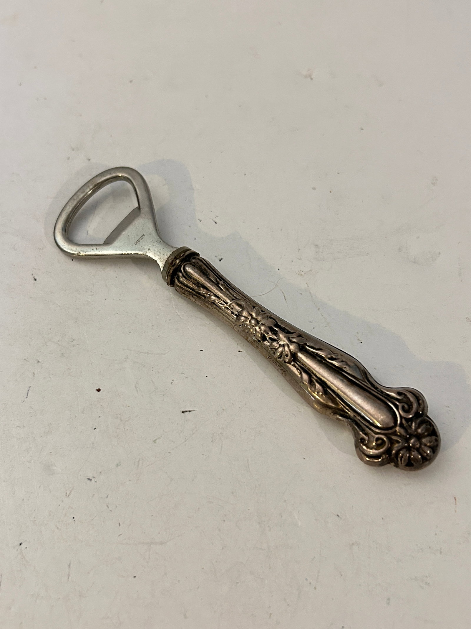 Vintage Sterling Silver Handle floral Bottle Opener 5 1/2": Vintage Sterling Silver Handle floral Bottle Opener 5 1/2" Please view all photos as they are part of the description and condition of this Item, Feel free to contact me with questions or picture requ