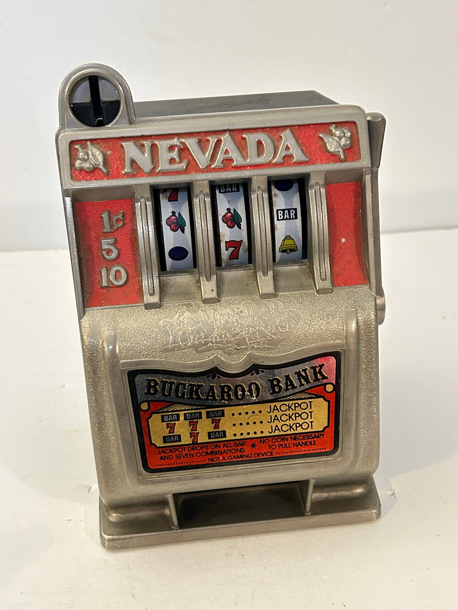 Vintage BUCKAROO BANK Las Vegas Metal Bank Slot Machine Toy Nevada Collectible working: Vintage BUCKAROO BANK Las Vegas Metal Bank Slot Machine Toy Nevada Collectible working Please view all photos as they are part of the description and condition of this Item, Feel free to contact me wi