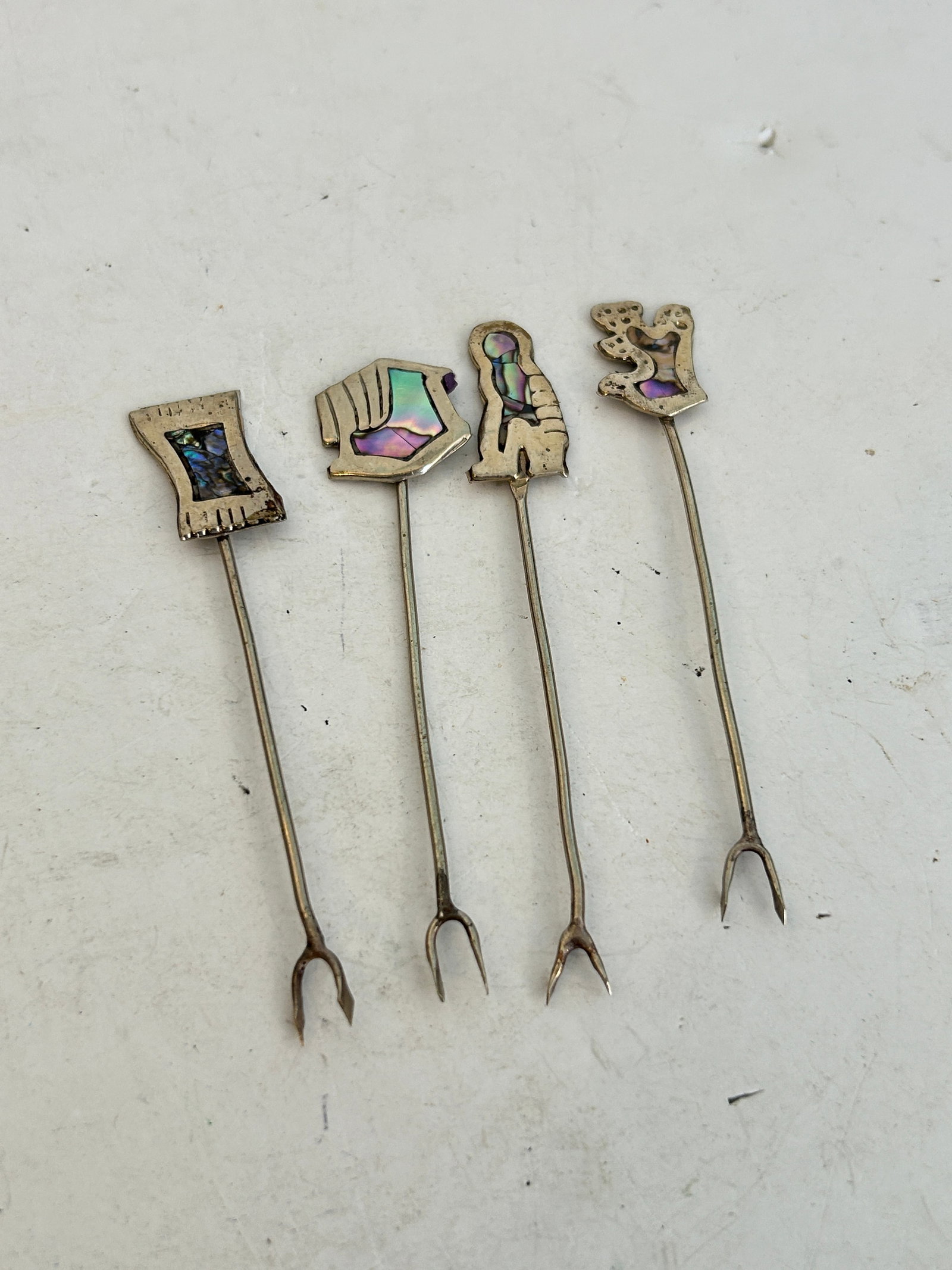 Vintage Abalone Inlay Alpaca Silver Cocktail Forks, 4 Picks: Vintage Abalone Inlay Alpaca Silver Cocktail Forks, 4 Picks Please view all photos as they are part of the description and condition of this Item, Feel free to contact me with questions or picture req