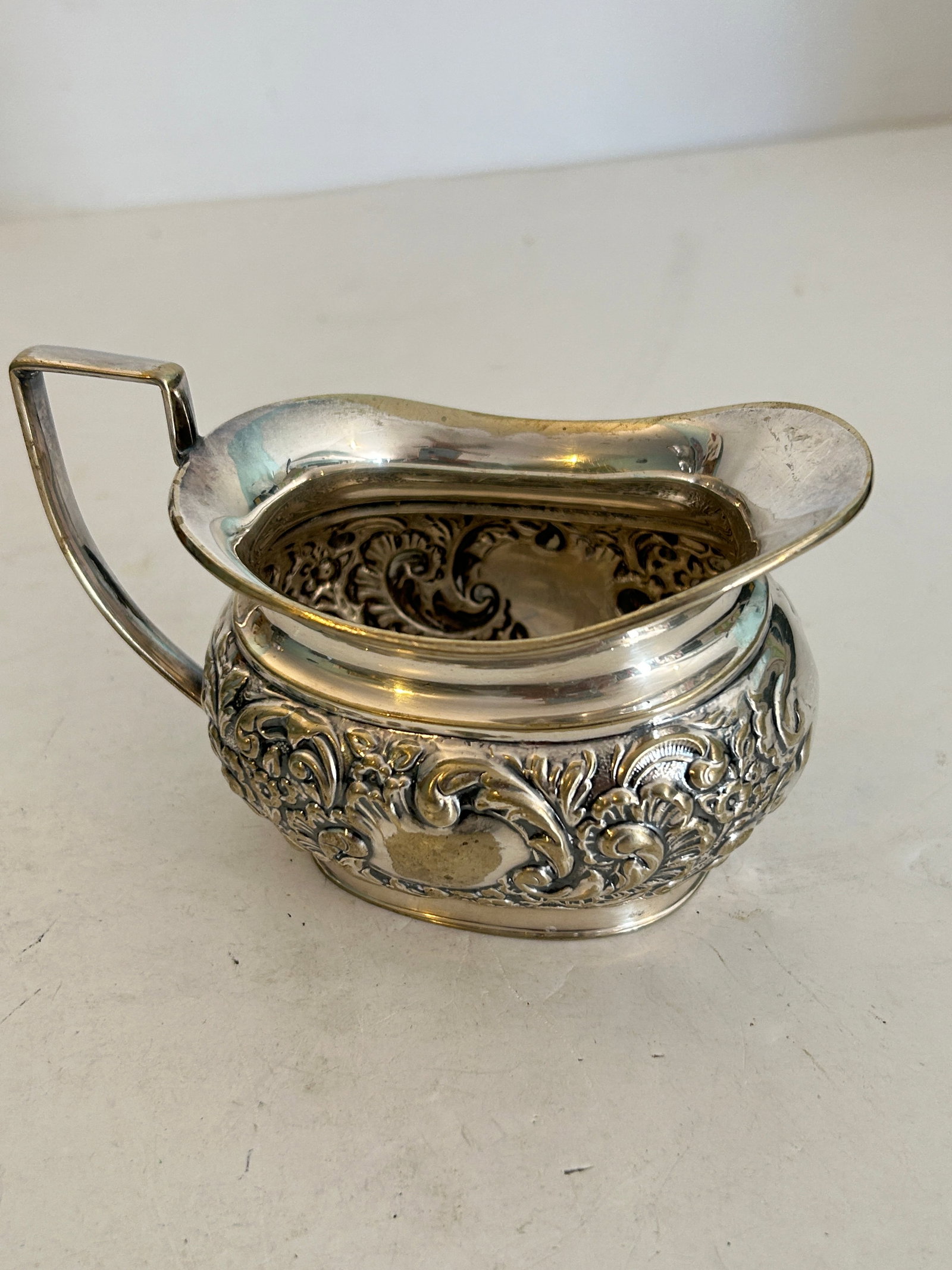antique repousse silver creamer or miniature pitcher with detailed floral embossing (1 of 5)