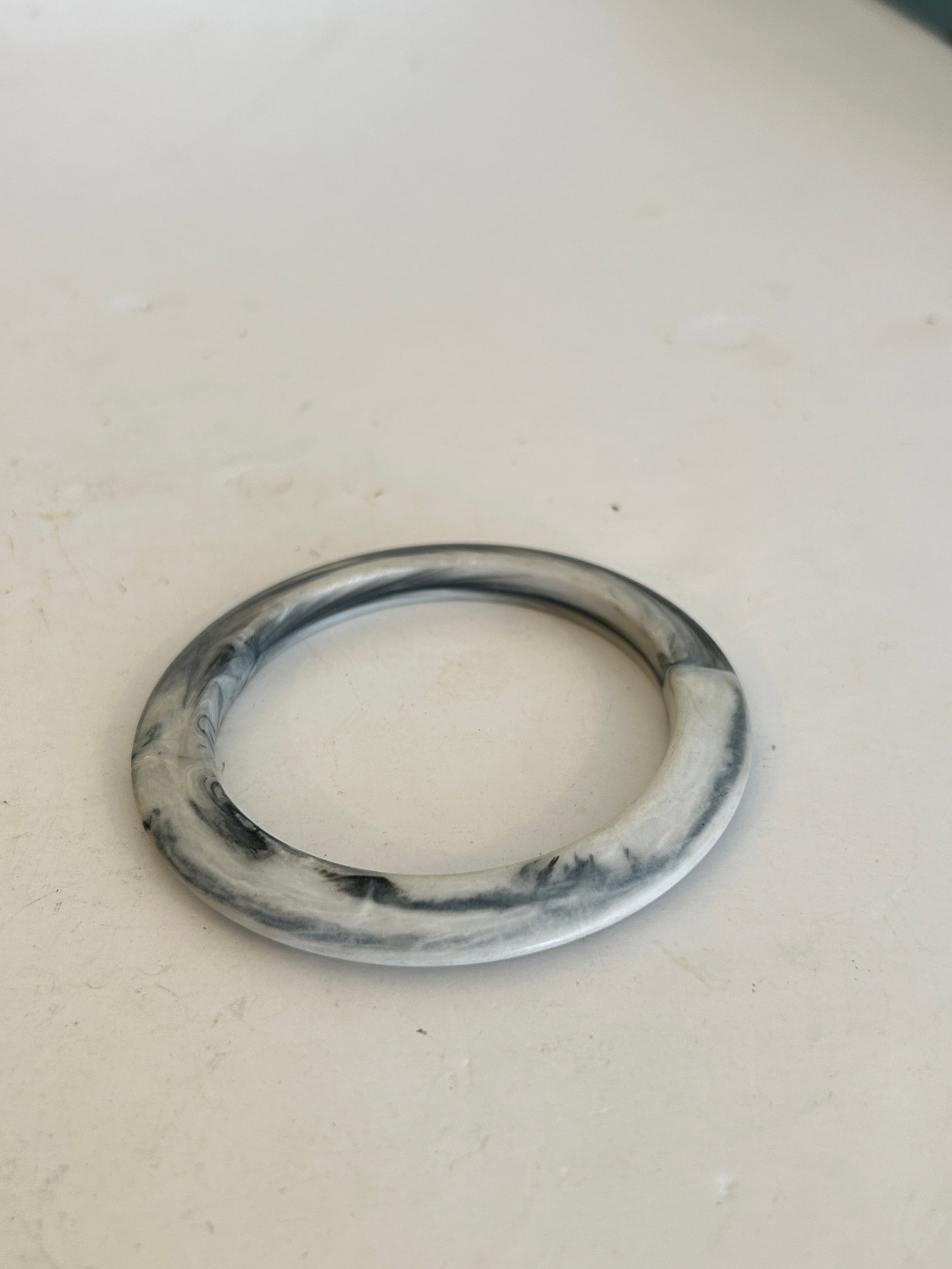 Vintage grey Marbled Swirled Molded Plastic Bangle 7": Vintage grey Marbled Swirled Molded Plastic Bangle 7" Please view all photos as they are part of the description and condition of this Item, Feel free to contact me with questions or picture requests!