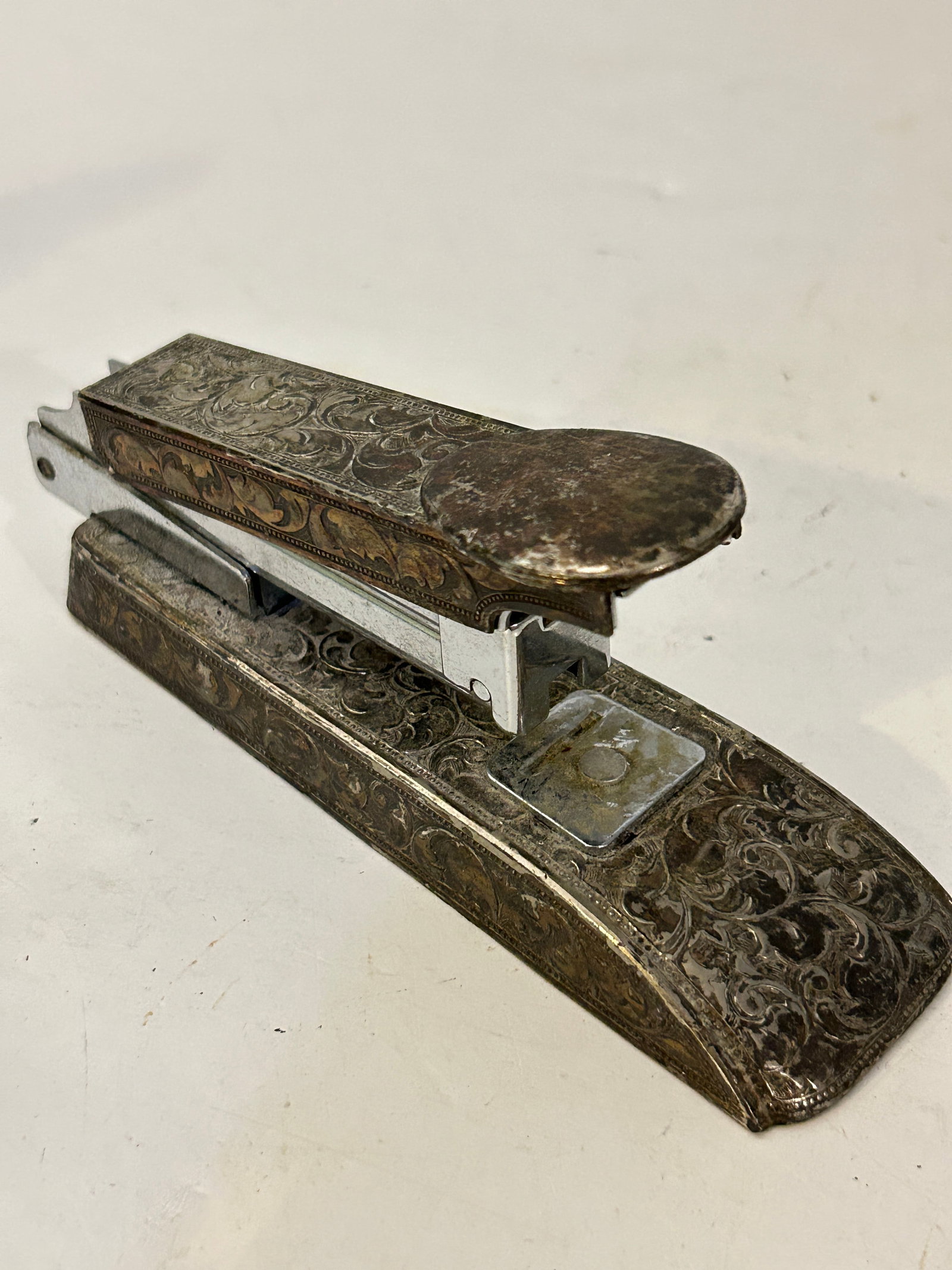 Ornately Decorated Silver Plate Vintage Victorian Antique Stapler 5 1/2": Ornately Decorated Silver Plate Vintage Victorian Antique Stapler 5 1/2" Please view all photos as they are part of the description and condition of this Item, Feel free to contact me with questions o