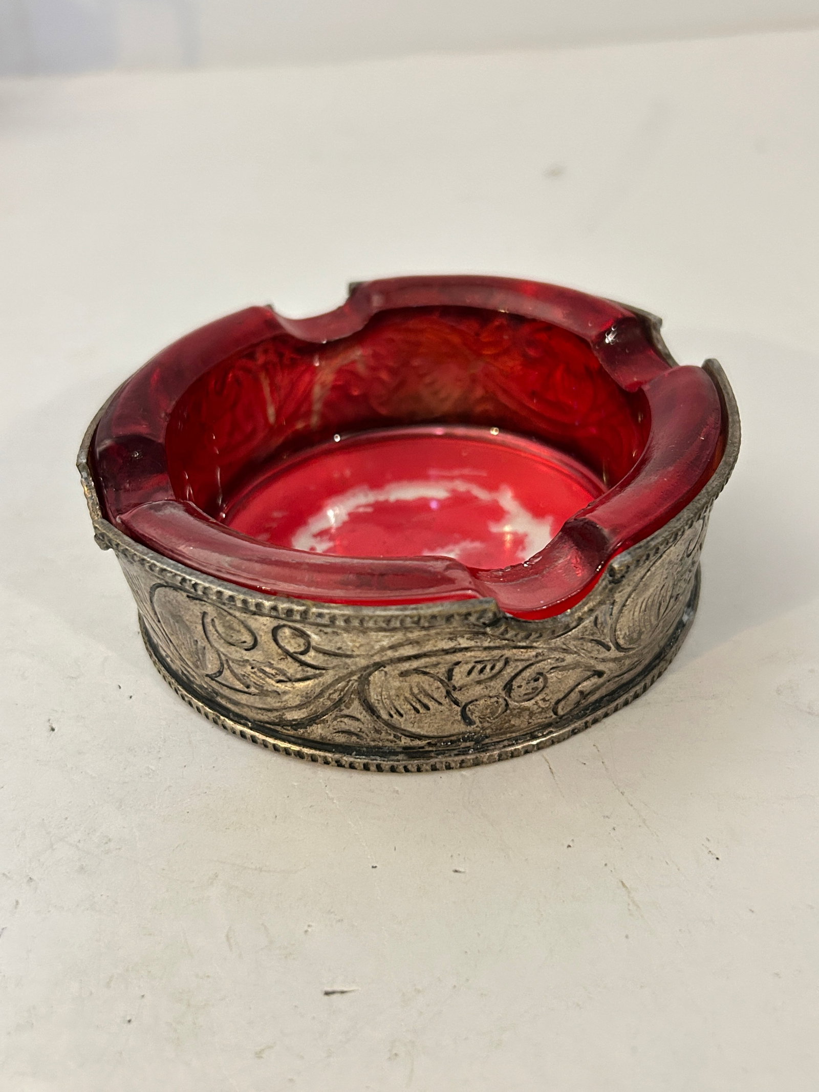 Vintage Glass Ashtray with Silver Overlay 4 1/4": Vintage Glass Ashtray with Silver Overlay 4 1/4" Please view all photos as they are part of the description and condition of this Item, Feel free to contact me with questions or picture requests! Used