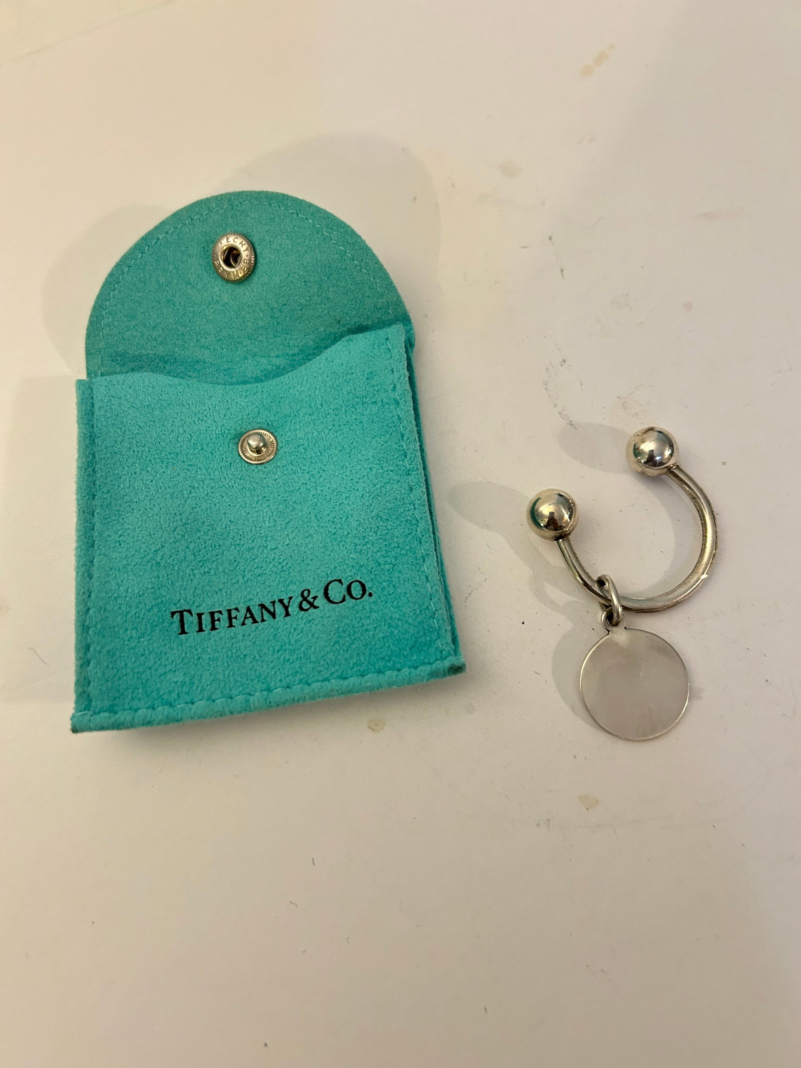 Authentic Tiffany Co Sterling Silver Key Chain Ring Round Tag Pouch: Authentic Tiffany Co Sterling Silver Key Chain Ring Round Tag Pouch Please view all photos as they are part of the description and condition of this Item, Feel free to contact me with questions or pic
