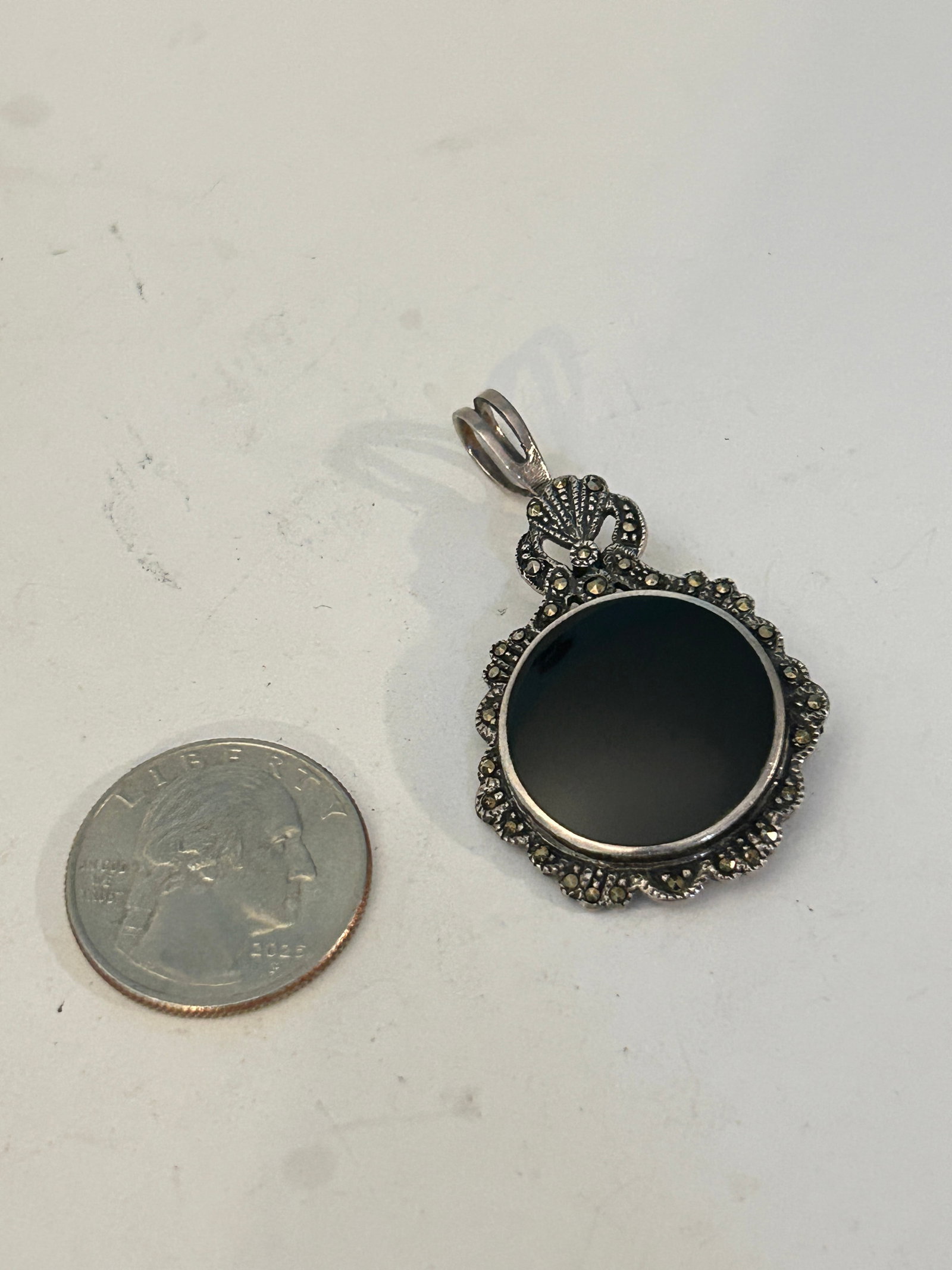 Sterling Silver Onyx Marcasite Pendant: Sterling Silver Onyx Marcasite Pendant Please view all photos as they are part of the description and condition of this Item, Feel free to contact me with questions or picture requests! Used Item AS I