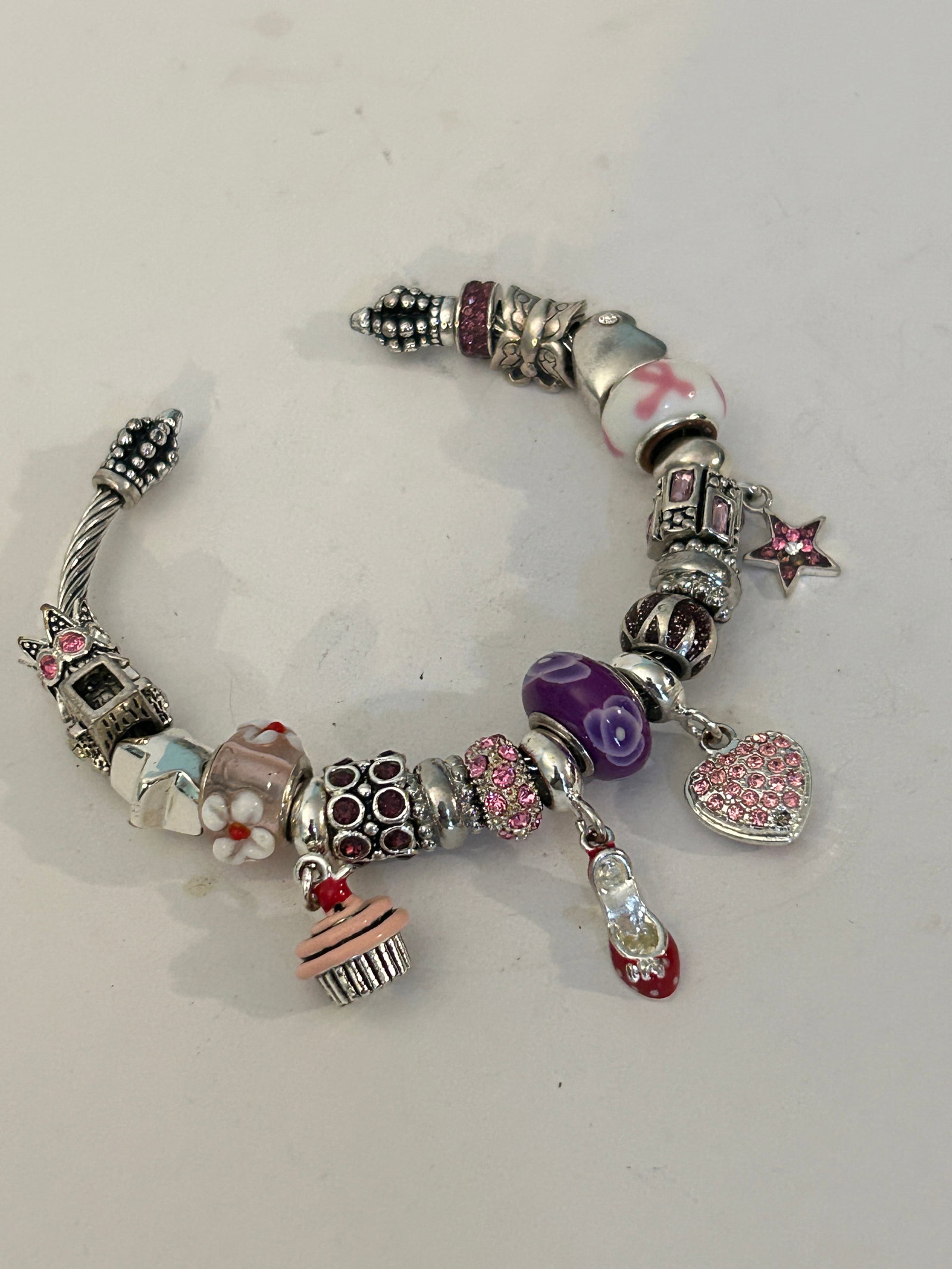 Vintage Sterling Silver charm bracelet featuring a mix of charms (1 of 5)