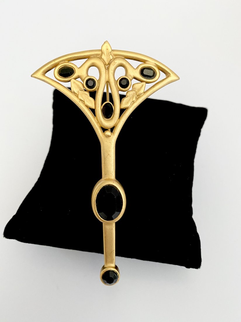 SIGNED KARL LAGERFELD OVERSIZED 80'S SEPTOR BROOCH: An exceptional 80's signed Karl Lagerfeld jeweled onyx glass septor brooch. The piece measures 4" long and 2 1/2" wide.