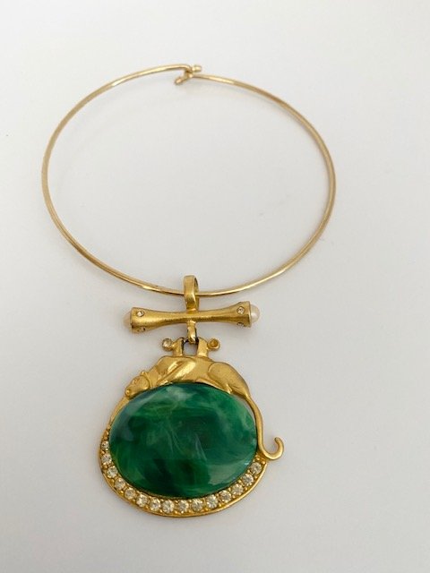 RESTING PANTHER 80'S JEWELED FAUX JADE RUNWAY NECKLACE: An oversized matte finish resting panther reclined over a jeweled faux jade slab. signed on the reverse; made in the USA. The pendant measures over 3" and sits on a gold plated neck wire