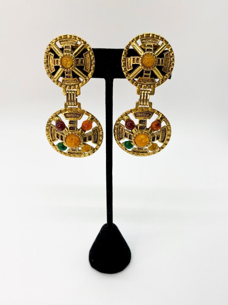 QUINTESSENTIAL 80'S DROP JEWELED MOGUL RUNWAY EARRINGS: Unsigned gold-tone earrings. Great movement. Highly detailed with jewel-toned cabochon accents. Clip back. 1" & 1 1/4" diameters. 2 1/2" total length. 