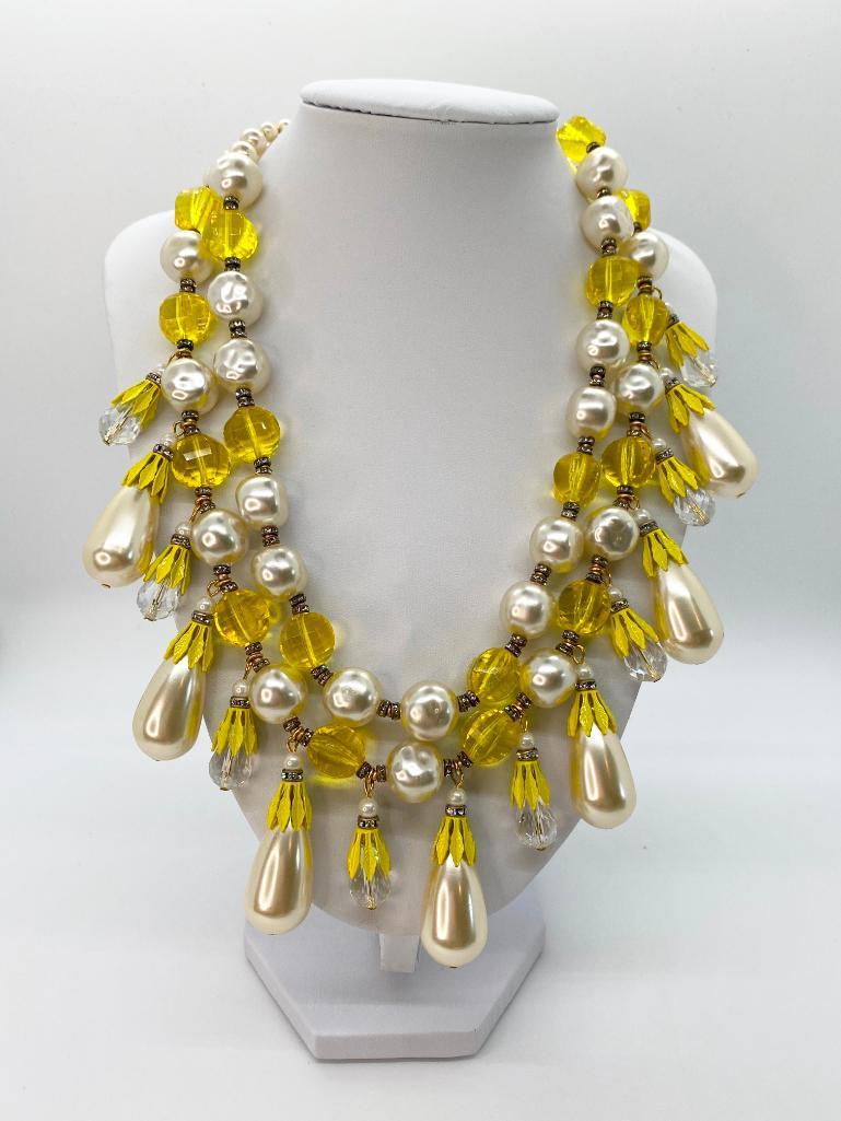 VINTAGE 70'S SIGNED ART OVERSIZED PEARL CANARY NECKLACE: Signed double strand necklace featuring textured faux pearls. faceted canary yellow crystals, faceted crystal and faux pearl drops with yellow leaf bead caps, and rhinestone rondelles. Hook clasp with