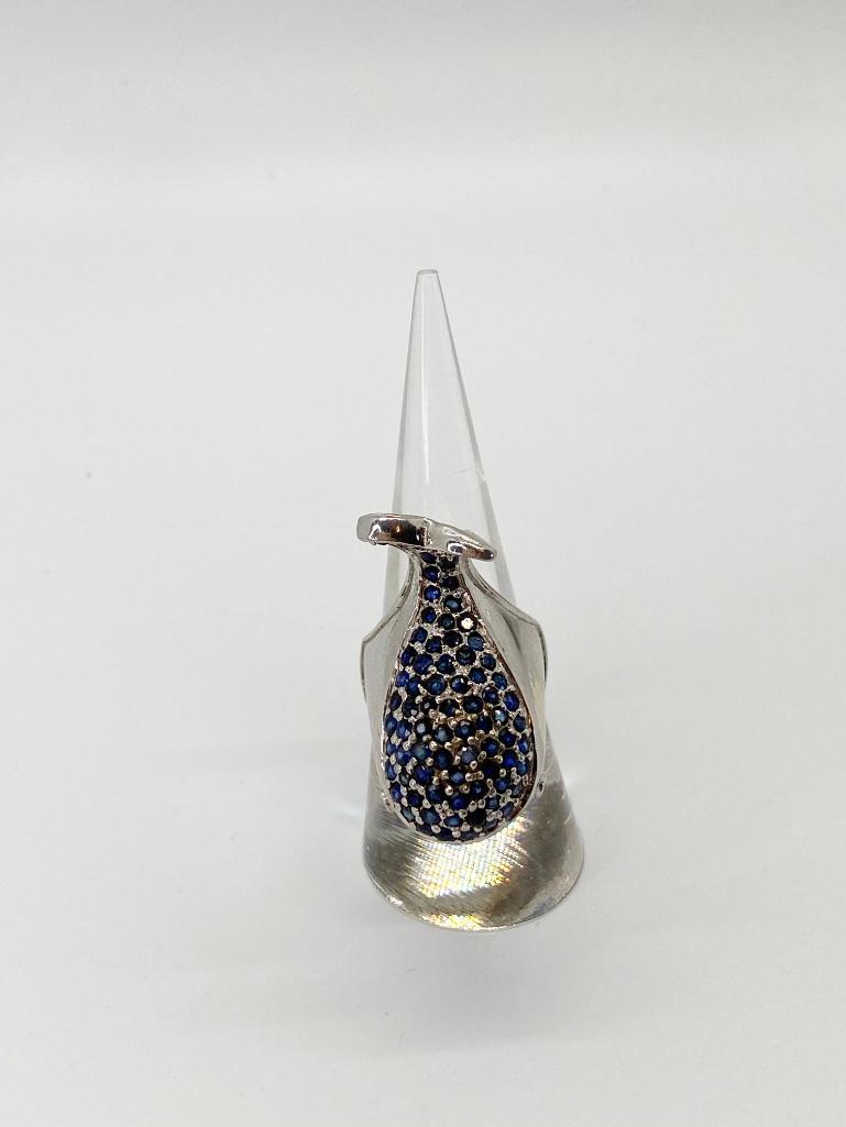 A CUSTOM MADE 80S STERLING WHALE RING SAPPHIRES & RUBYS: Whimsical sterling whale ring with ruby eyes and pave sapphires. Stamped .925. Size 7. All stones have been tested with a Presidium Gem Tester II.