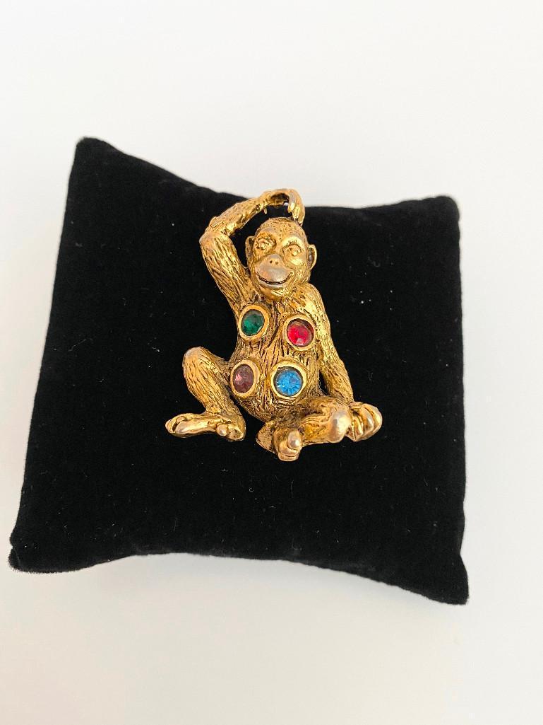 VINTAGE 60'S JEWELS OF FANTASY FIGURAL JEWELED MONKEY: A monkey brooch with so much personality with a faux jeweled belly. The piece measures 2"