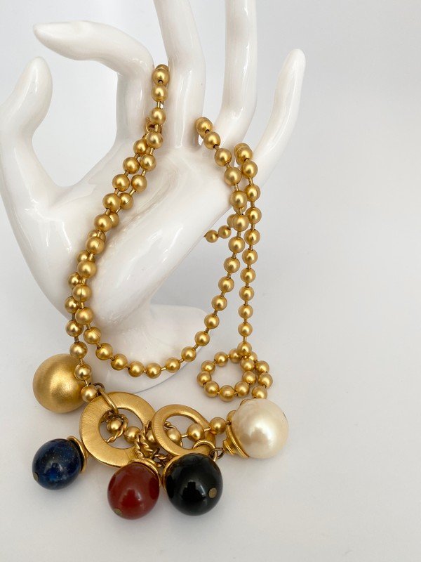 AN EXCEPTIONAL HIGH KARAT SEMI PRECIOUS CHARM NECKLACE (1 of 2)