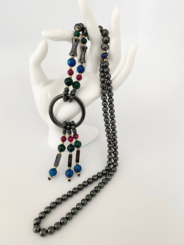 VINTAGE HEMATITE GEOMETRIC SEMIPRECIOUS 14K NECKLACE: A 28" hematite necklace with a 4" geometric tasseled drop with semi precious stones with 14k beads