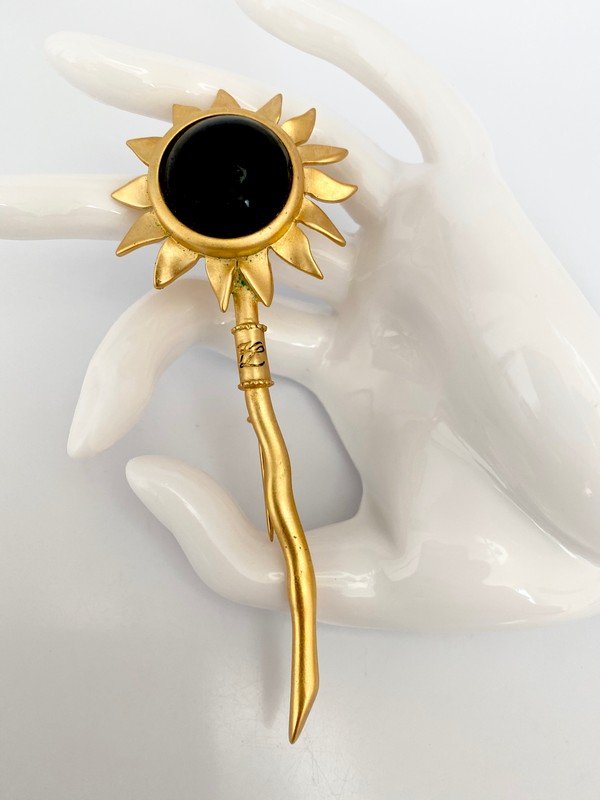 VINTAGE KARL LAGERFELD PARIS ONYX GRIPOIX SEPTOR PIN: A 4 1/2" long sunburst septor pin by Karl Lagerfeld from the 80's with oversized onyx gripoix stone