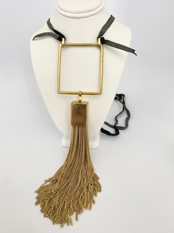 $1600 BISJOUX BRONZE HEAVY TASSEL RUNWAY NECKLACE: An oversized signed Bisjoux bronze heavy tassel necklace on adjustable lambskin leather corn. The tassel is geometric and measures 8" and hangs from an 46" leather cord