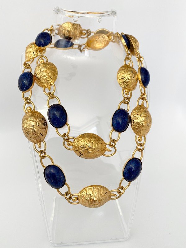 A VINTAGE BEZEL SET LAPIS AND TURTLE RUNWAY NECKLACE: A 33" bezel set lapis stone and turtle figural necklace or can be fashioned as a bezel. Great artistic detail to the turtles.