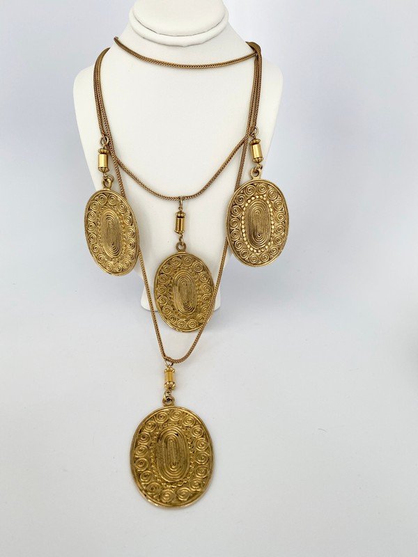RARE YSL YVES ST LAURENT RUNWAY 1967 TRIBAL NECKLACE: A rare 17" signed YSL toggle clasped necklace from the 1967 runway collection. Each medallion disc drops 3 1/2" with a total drop of over 15"