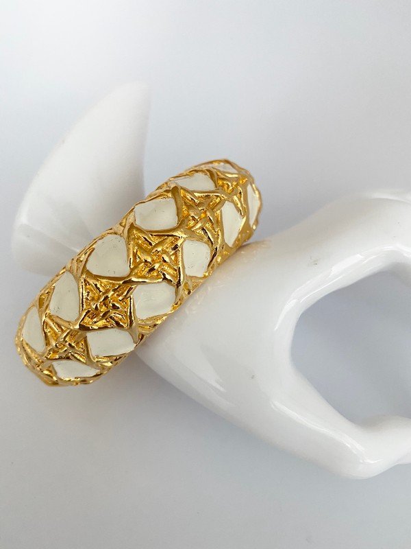 VINTAGE K.J.L. KENNETH LANE ENAMEL BANGLE BRACELET: An early vintage signed K.J.L. enameled bangle bracelet. The piece is heavy and in perfect collection from a private collection and measures 2 1/2" round