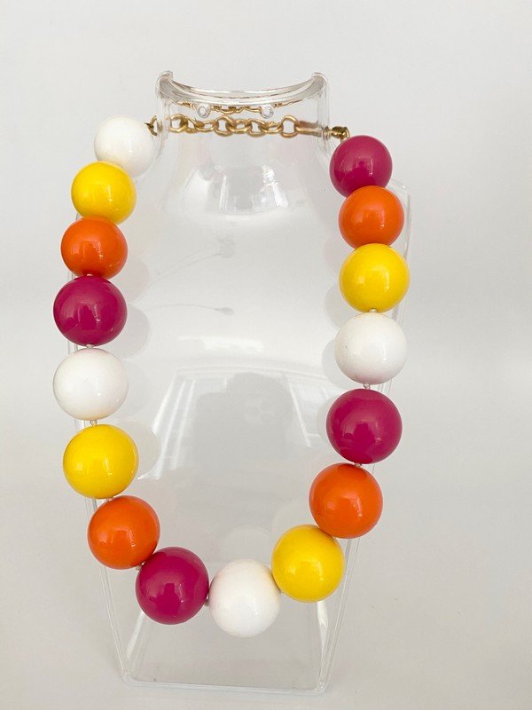 AN OVERSIZED JAWBREAKER AMERICAN 60'S BEAD NECKLACE: An oversized hand knotted on silk heavy resin beads with goldtone hardware, 1960's by Monet. Measures 18"