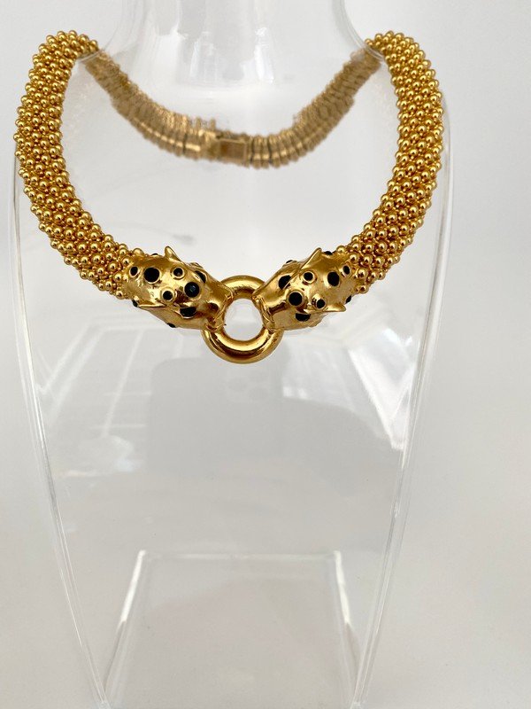 RARE VINTAGE CINER SPOTTED PANTHER CAVIAR NECKLACE: A rare 18" choker made of hundreds of goldtone rows of caviar beads with a double headed black onyx glass cabochoned pair of panther heads