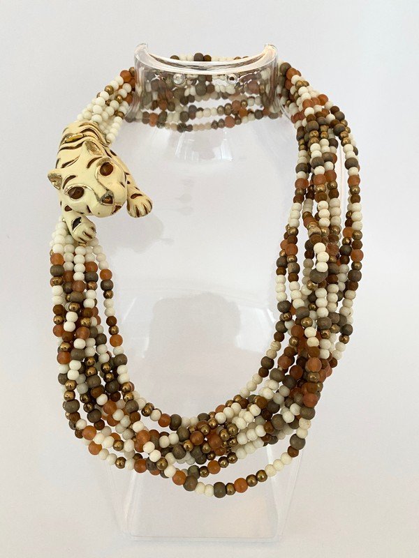 A RARE SIGNED CINER ENAMELED PANTHER VINTAGE NECKLACE: An 11 strand necklace by Ciner that measures 20" with a large 3" enameled resting animal clasp
