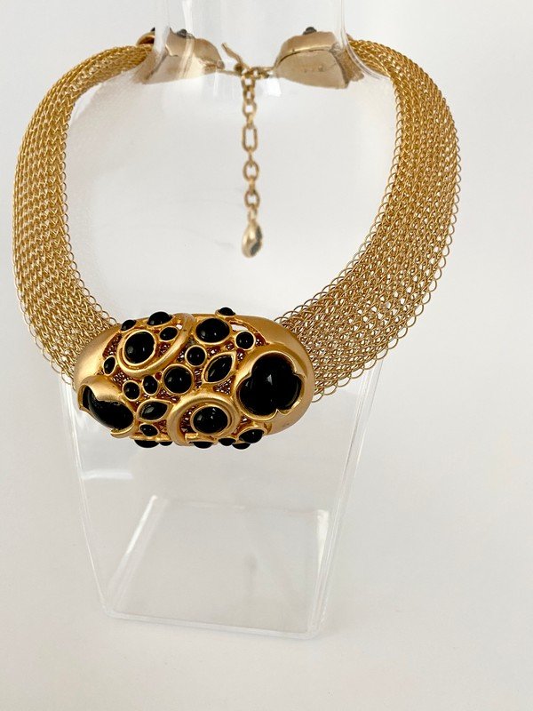 VINTAGE JAY STRONGWATER OVERSIZED RUNWAY ONYX NECKLACE: An early 80's signed Jay S. necklace from neiman marcus with heavy goldtone mesh and onyx jeweled and enameled medallion and clasp. Measures 22" with a 3" centerpiece
