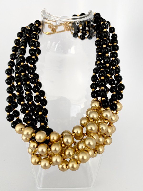 VINTAGE KENNETH LANE ONYX & GOLD GLASS TORSADE NECKLACE: An 18" torsade necklace with large clasp signed kenneth lane, made of 8 strand of hand knotted on silk glass beads