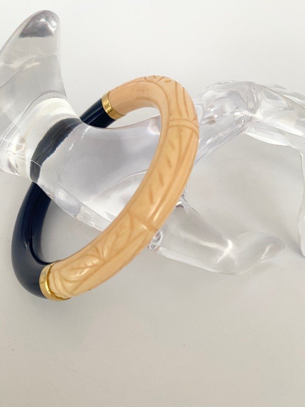 VINTAGE SIGNED GIVENCHY PARIS LAPIS CORAL RESIN BANGLE: A vert rare signed Givenchy Paris half lapis and half carved coral resin bangle bracelet. The inner opening is 2 3/4" round