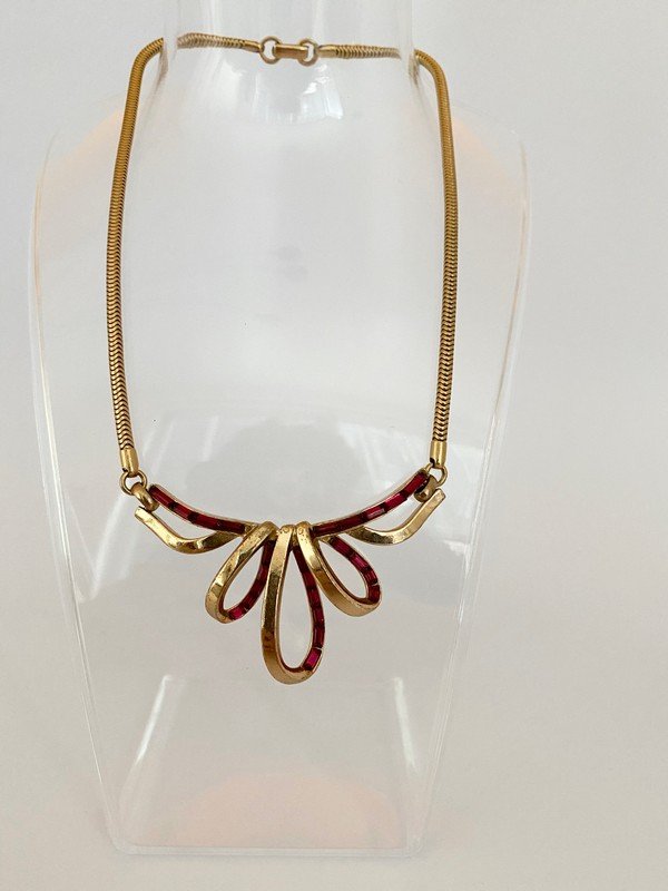 VINTAGE TRIFARI INVISIBLE SET RUBY GLASS BOW NECKLACE: A rare 16" choker signed Trifari with invisible set ruby glass baguette stones