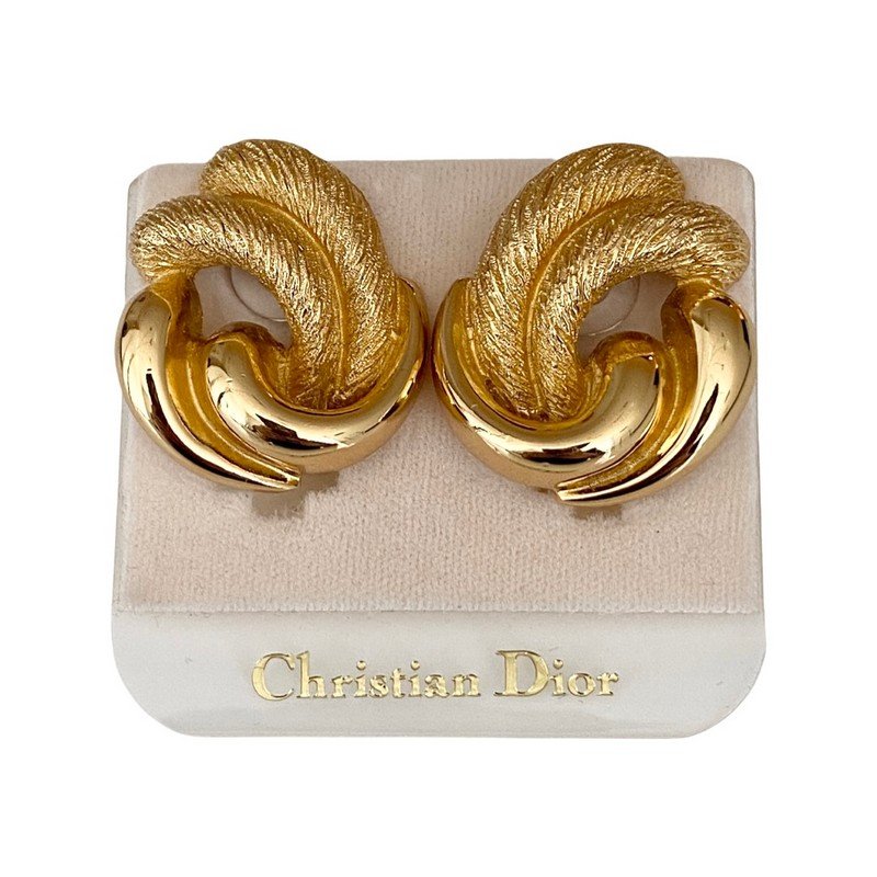VINTAGE CHRISTIAN DIOR PARIS OVERSIGNED 80'S EARRINGS: A pair of never worn signed Christian Dior Paris ear clips on oriignal card. Each measures 1 1/2"