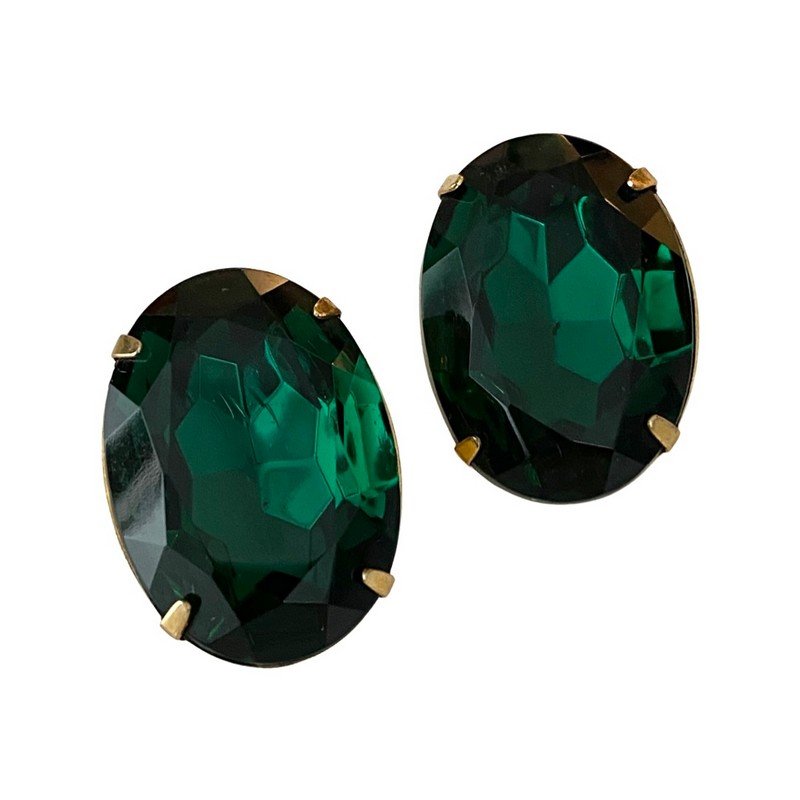 VINTAGE YSL YVES ST LAURENT EMERALD CRYSTAL EARRINGS: A rare pair of signed YSL clip on earrings with prong set massive oval emerald facet cut crystal stones. Each measures 1"