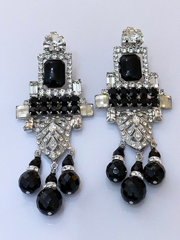DESIGNER SIGNED LARRY VRBA RUNWAY CHANDELIER EARRINGS: A pair of tight clip on earrings measuring 5" with prong set crystals and glass stones by Lawrence Vrba. Flawless Condition