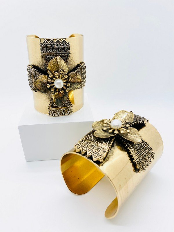 A PAIR OF OVERSIZED DISTRESSED FAUX PEARL RUNWAY CROSS CUFF BRACELETS (1 of 2)