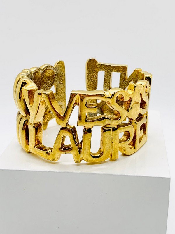 VINTAGE YVES ST LAURENT YSL RARE LOGO AD CAMPAIGN RUNWAY BRACELET (1 of 3)