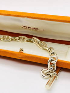 A VINTAGE SIGNED HERMES PARIS STERLING SILVER HEAVY TOGGLE BRACELET: A signed Hermes Paris sterling silver toggle bracelet with original box. Measures approx.8 1/2"