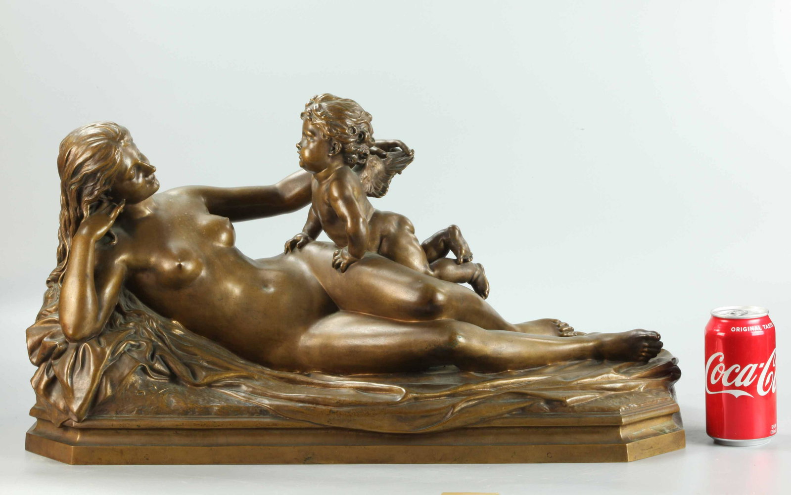 19 C light brown patina bronze sculpture, signed: 19th century light brown patina bronze sculpture of pretty nude woman with a angel, signed GRAUK, very good condition, H: 12 inches, W: 24.75 inches D: 11 inches