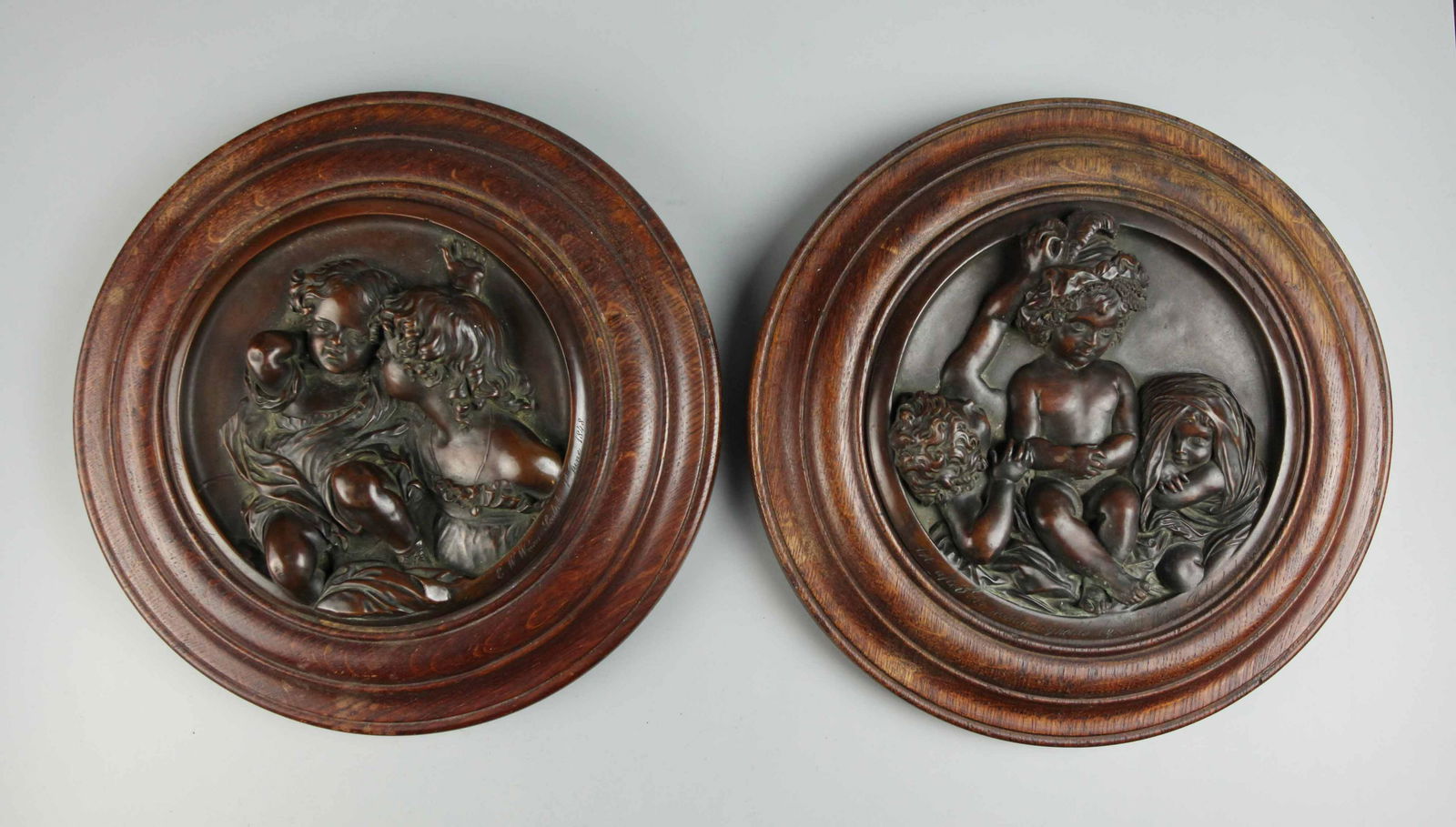 Pair 19 C bronze wall plaques with wood frame, signed (1 of 7)