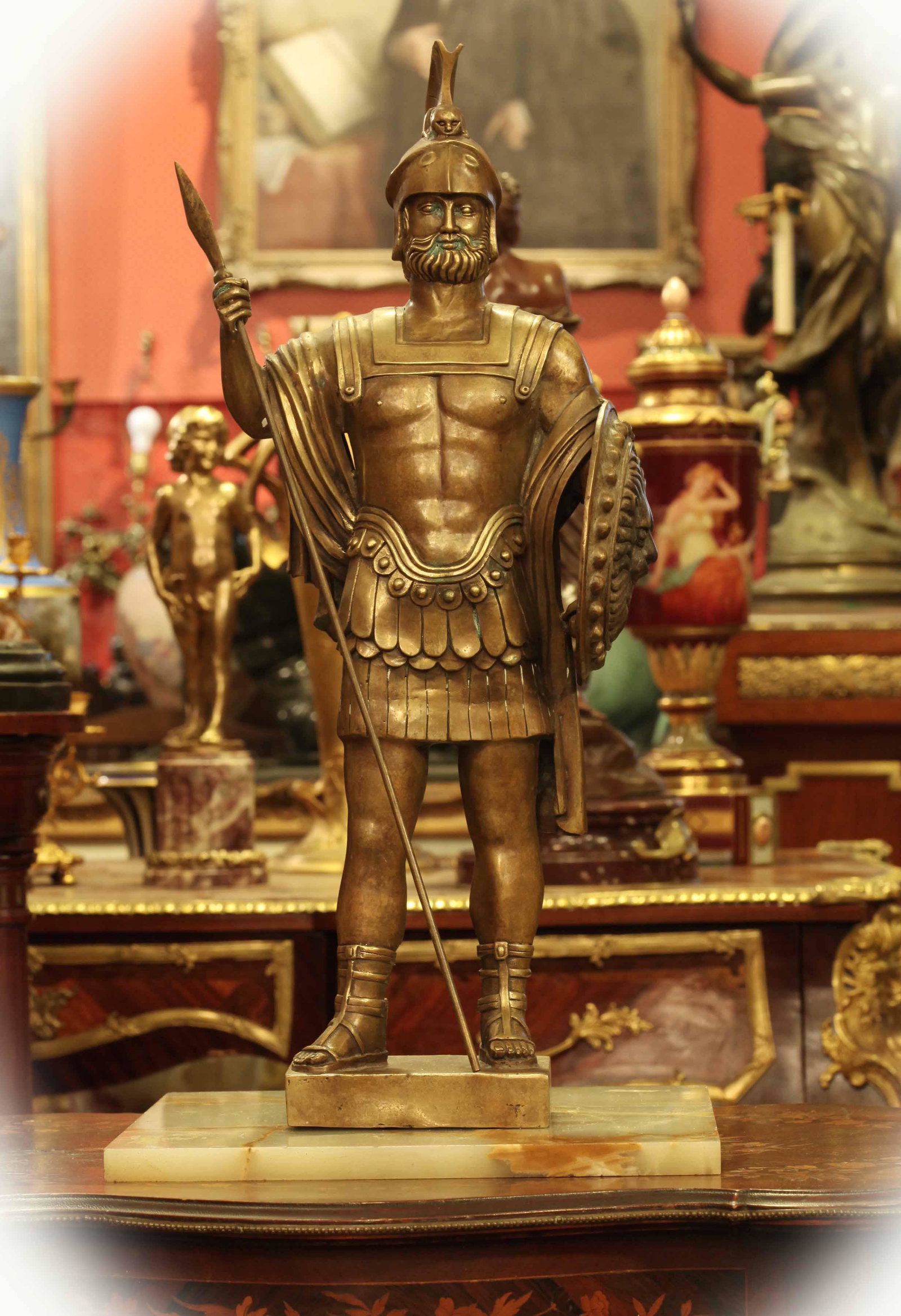 Early 20th century bronze with brown patina sculpture: Early 20th century bronze with brown patina sculpture of a soldier holding a spear and shield, good condition, W: 10 inches, H: 26 inches, D: 6 inches