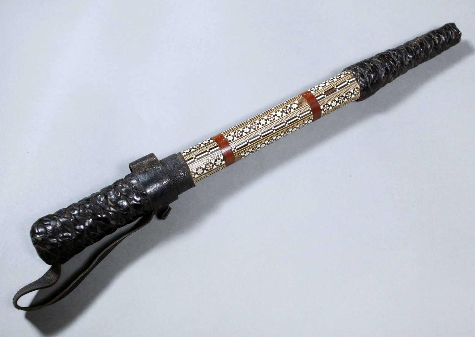 RARE Antique Arabian Inlay Wood Braided Leather Camel Whip & Hidden Dagger: RARE Antique Arabian Inlay Wood Braided Leather Camel Whip & Hidden Dagger. Vintage Inlay Leather Camel Whip & Dagger This is a leather Camel Whip with amazing detailed inlay throughout the handle. It